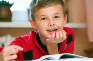 Boy reading book portrait